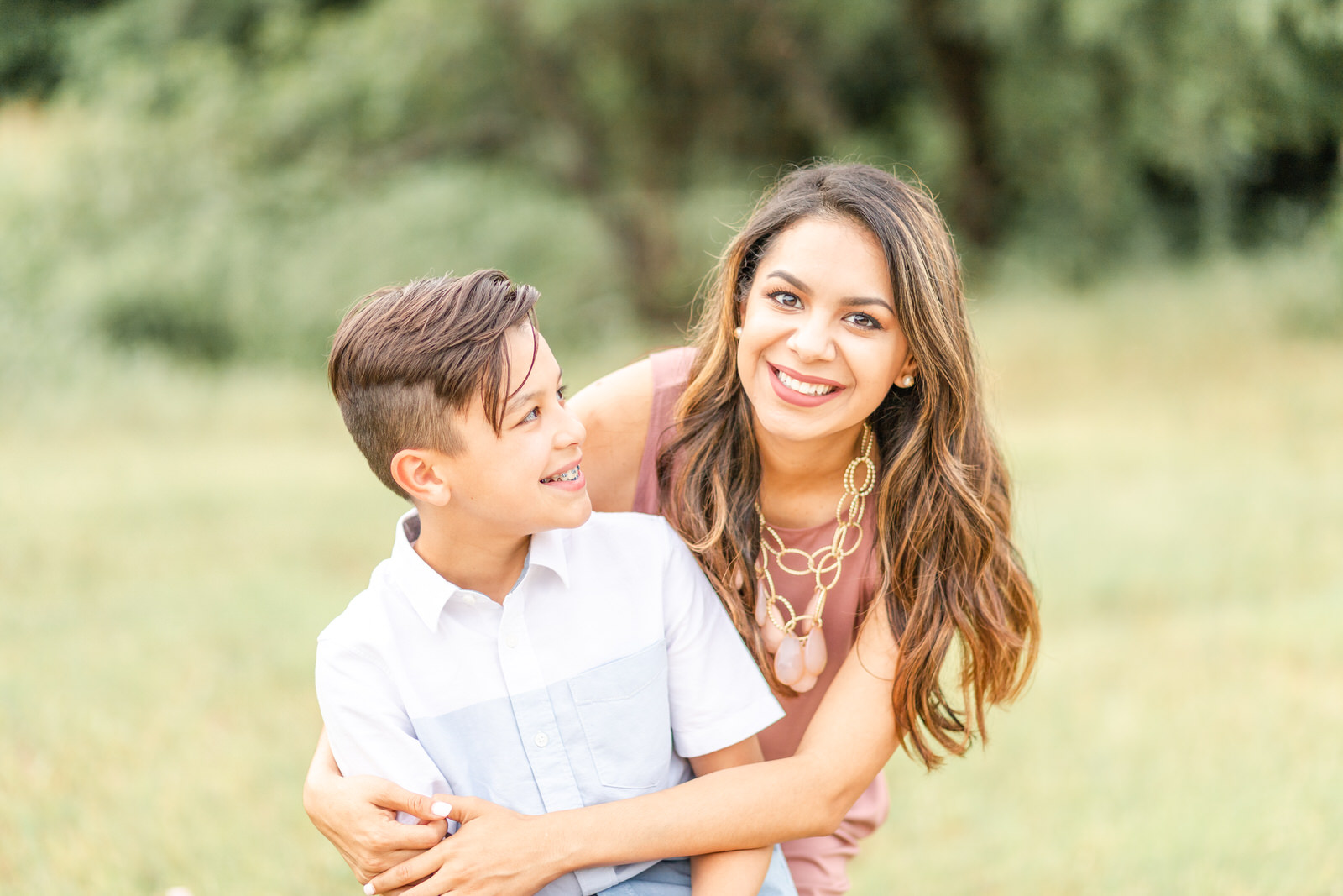 Mother and son smiling during a family session in Prosper Texas | ling waters photography